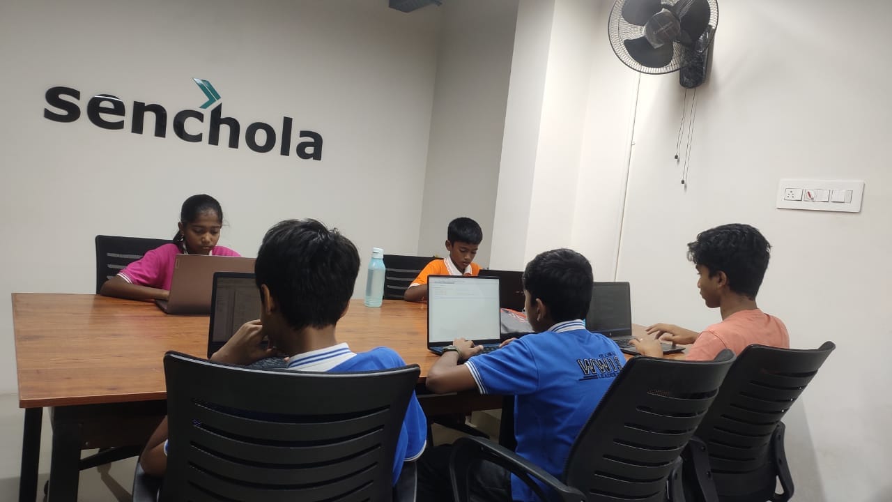 Students working on laptops during an IECP career exploration visit