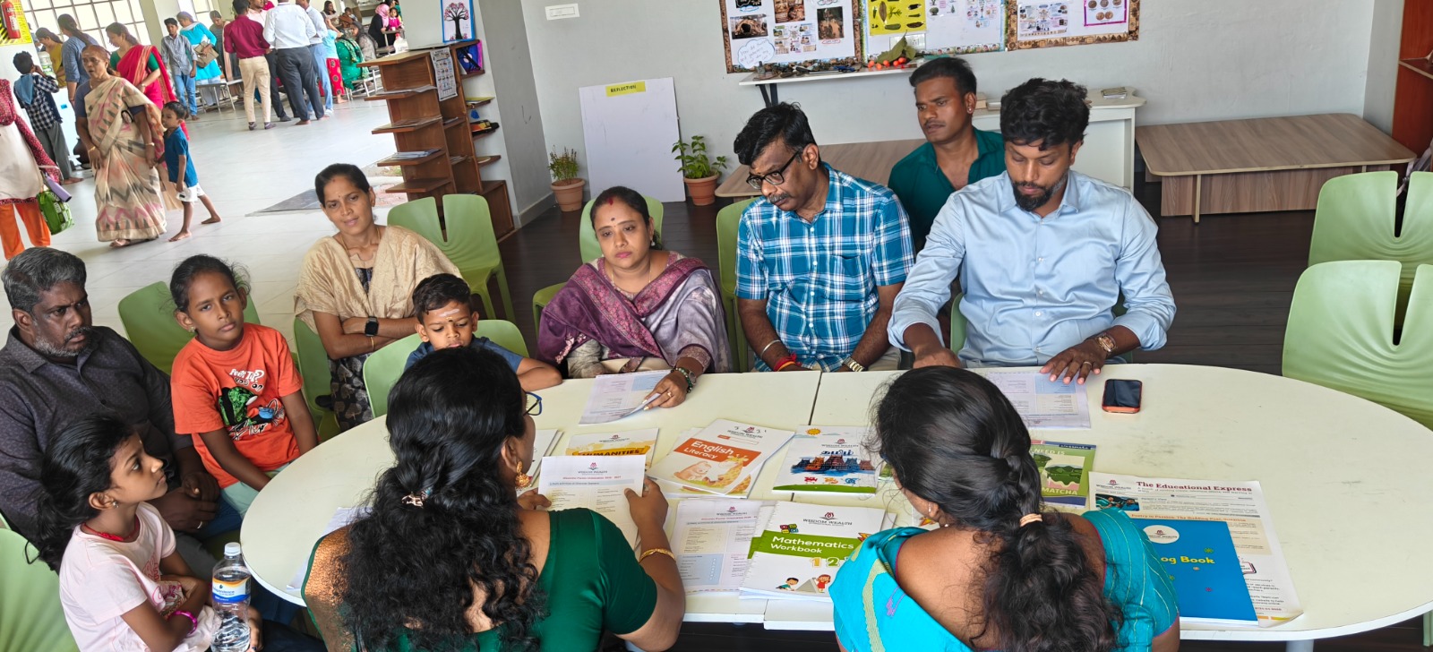 Parents meeting with WWIS staff to plan their campus visit