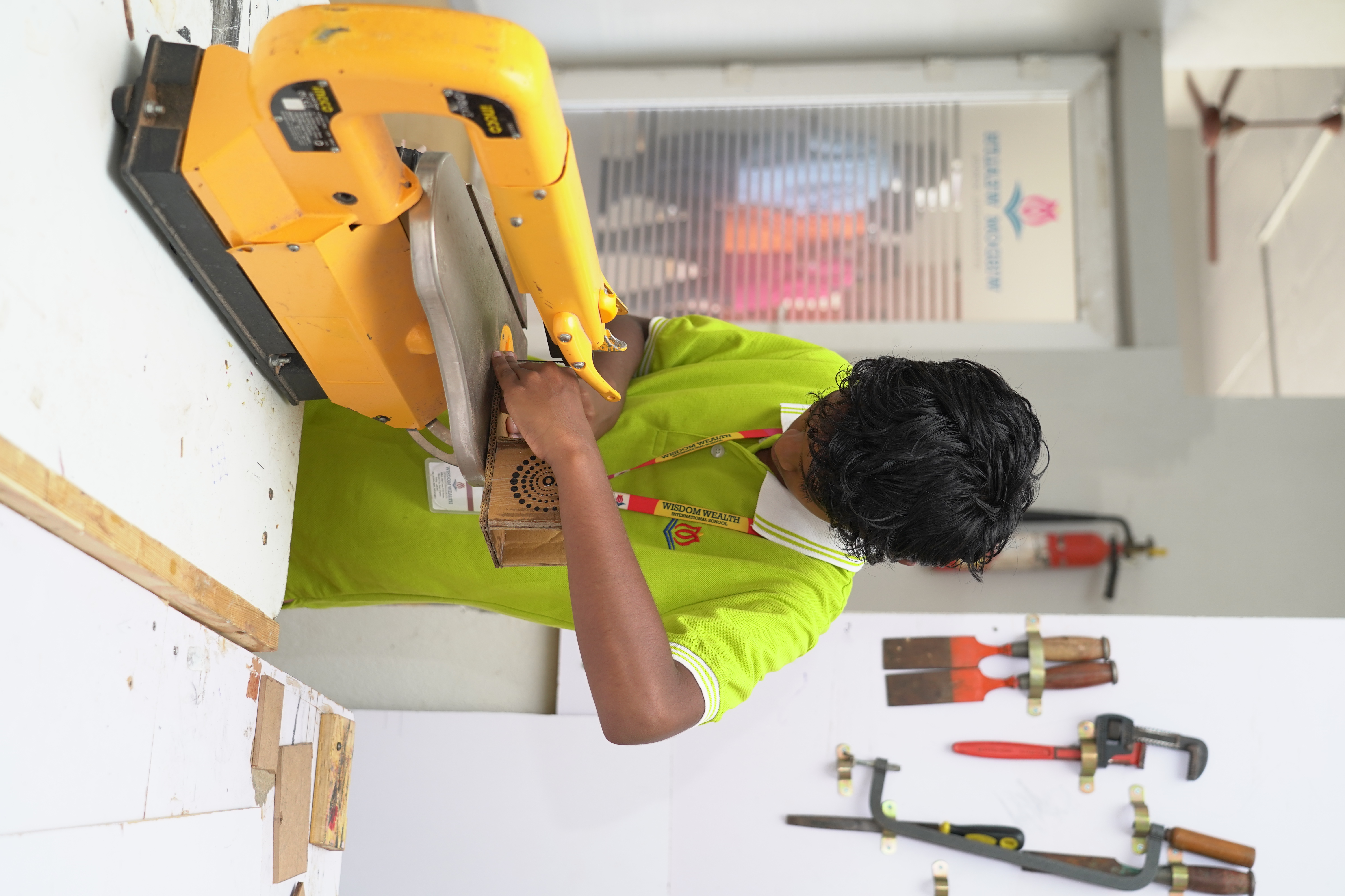 Student developing hands-on skills in the workshop
