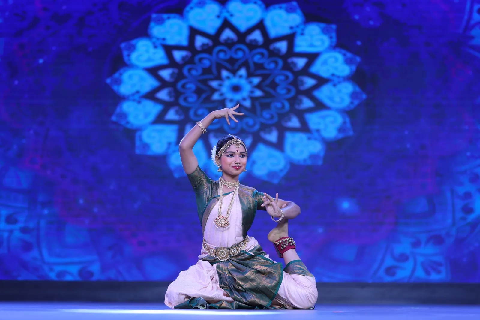 Student performing Bharatanatyam on stage