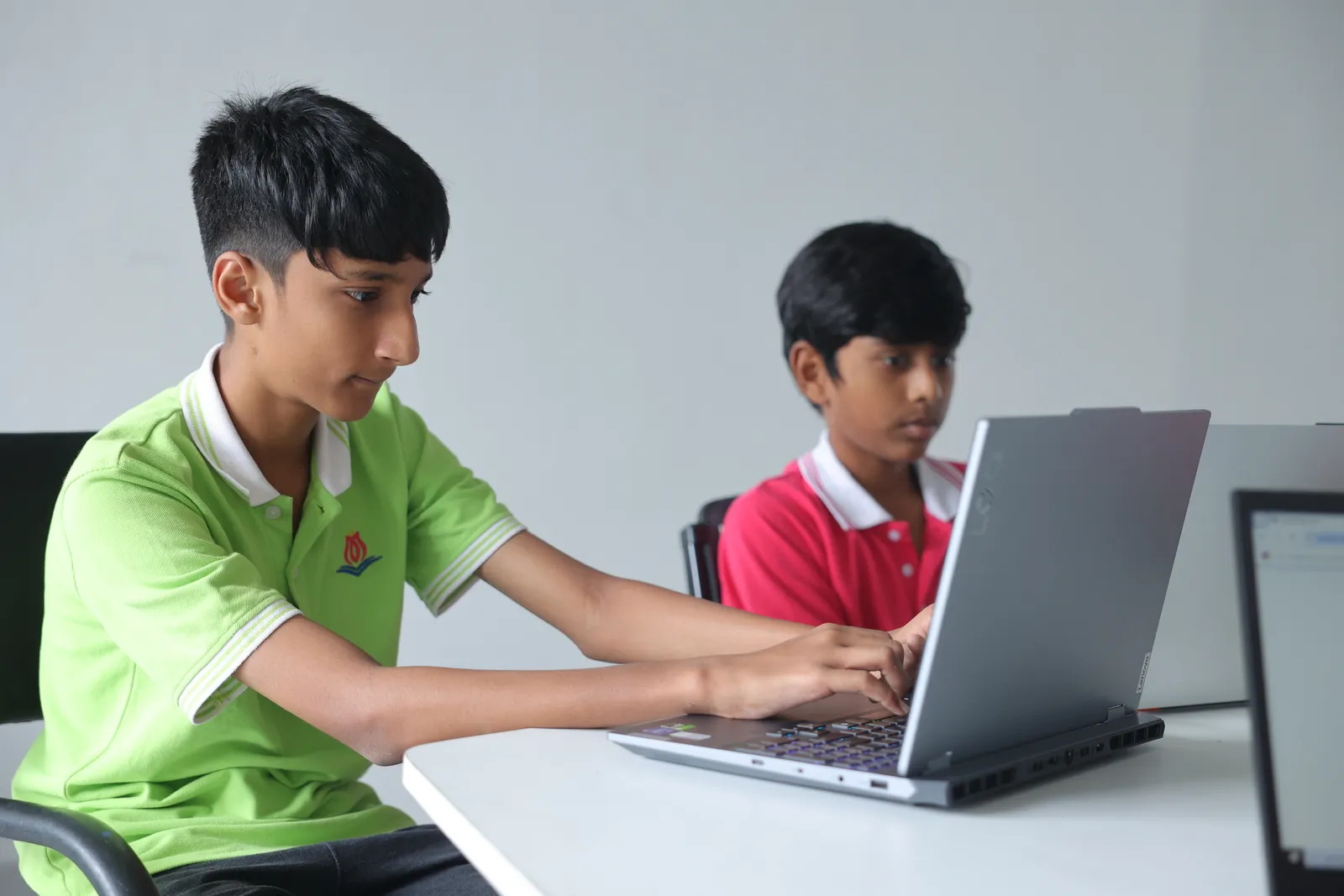 Students coding on laptops