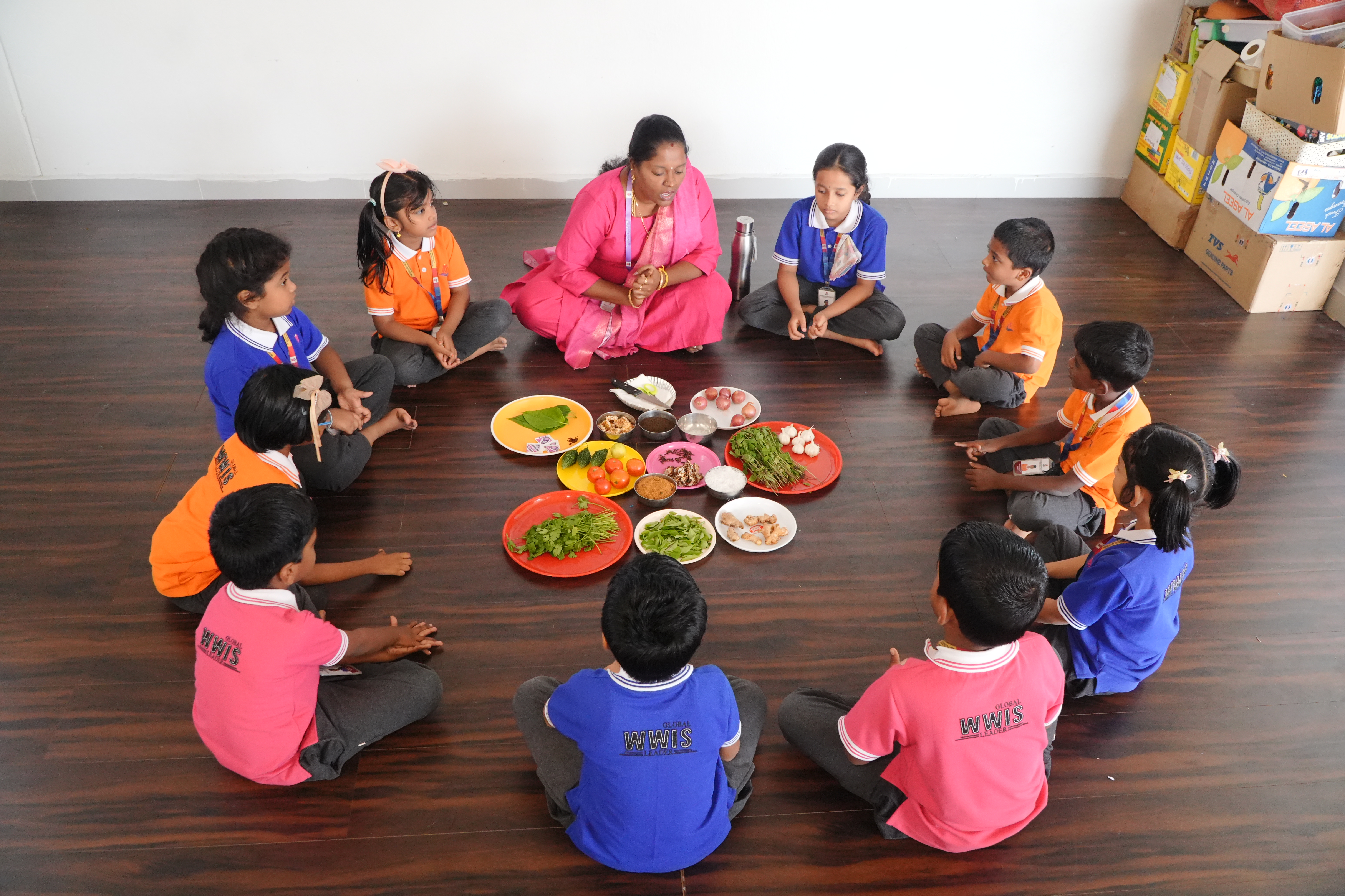 Students learning about fresh vegetables in a culinary arts circle time