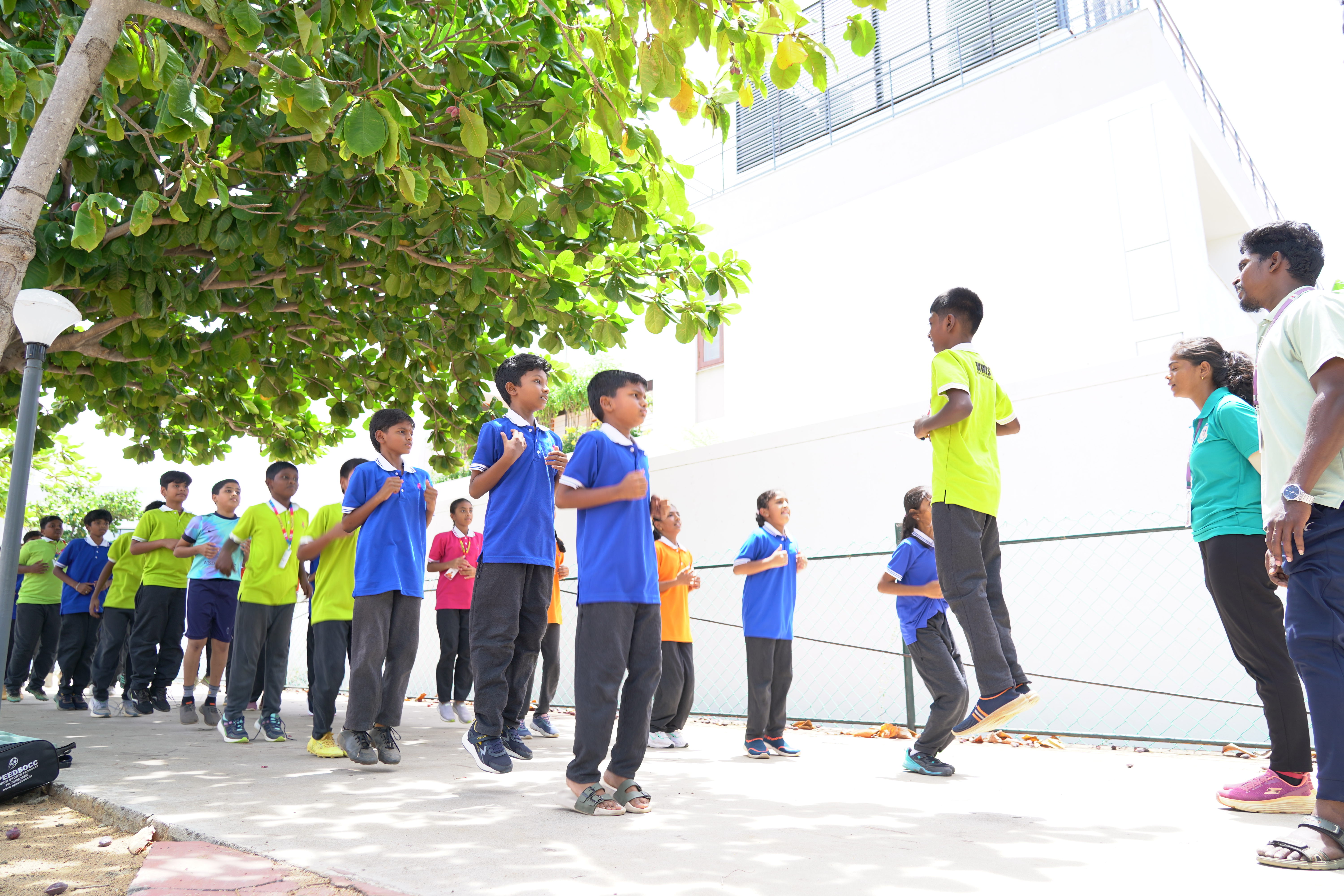Students doing morning exercise outdoors